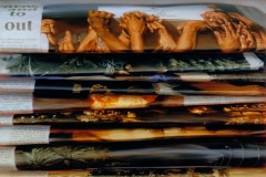 photo of one art work: stack of newspapers of Iraq war